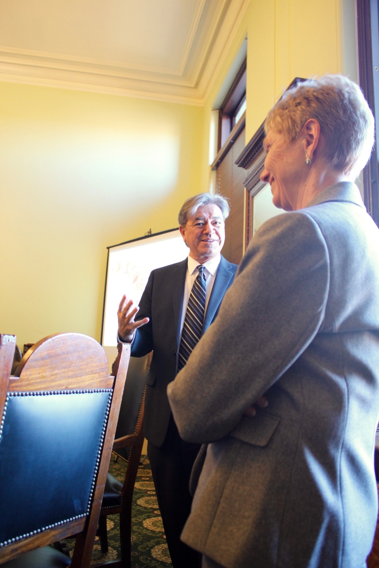 MassDevelopment President and CEO, Marty Jones speaks with Representative Cabral before Gateway Cities Caucus meeting